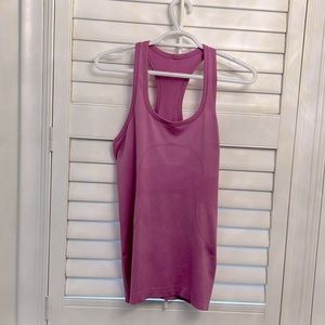 Pink tank small pull on front. Size 10 I think. No longer has tag